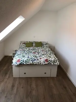 Ein Bett oder Betten in einem Zimmer der Unterkunft Moderne Neubauwohnung