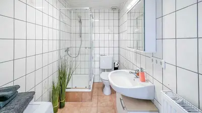 Ein Badezimmer in der Unterkunft Houses in Gau-Bischofsheim