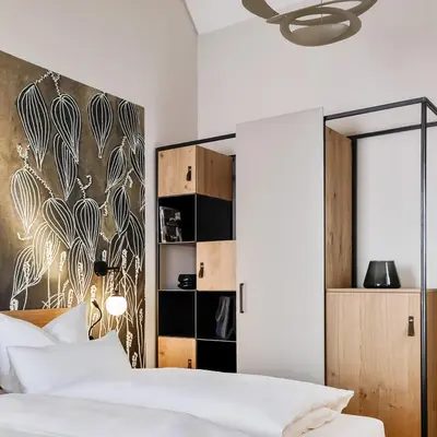 Ein Bett oder Betten in einem Zimmer der Unterkunft WeinHotel Fritz Walter