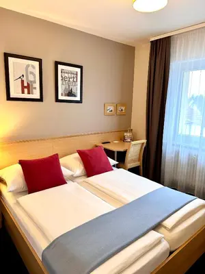 Ein Bett oder Betten in einem Zimmer der Unterkunft Hotel Friedrichstraße