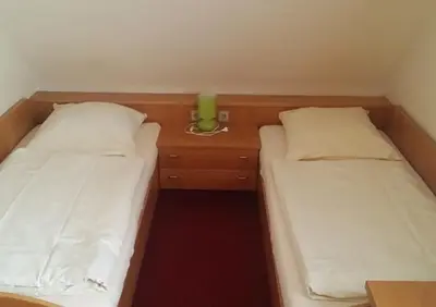Ein Bett oder Betten in einem Zimmer der Unterkunft Schwäbischer Hof