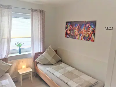 Ein Bett oder Betten in einem Zimmer der Unterkunft Ferienwohnungen Bella Vita