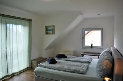 Ein Bett oder Betten in einem Zimmer der Unterkunft Heiligenbergblick