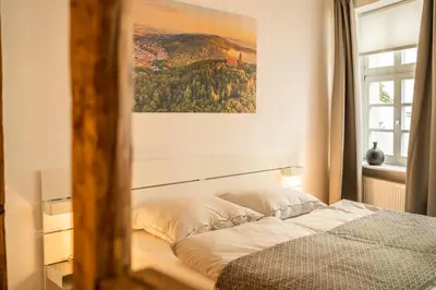 Ein Bett oder Betten in einem Zimmer der Unterkunft Klein aber Fein
