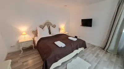 Ein Bett oder Betten in einem Zimmer der Unterkunft Villa unter dem Schloss