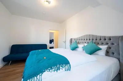 Ein Bett oder Betten in einem Zimmer der Unterkunft Lit Living - Luxury - Box Spring - Parking - 4 Bed Rooms - 13 persons - Duplex apartment