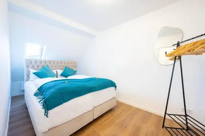 Ein Bett oder Betten in einem Zimmer der Unterkunft Lit Living - Luxury - Box Spring - Parking - 4 Bed Rooms - 13 persons - Duplex apartment