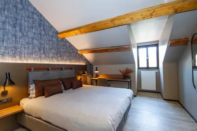 Ein Bett oder Betten in einem Zimmer der Unterkunft DAS Hotel by Hopfenschlingel