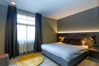 Ein Bett oder Betten in einem Zimmer der Unterkunft DAS Hotel by Hopfenschlingel