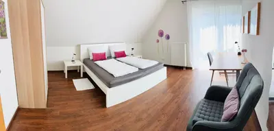 Ein Bett oder Betten in einem Zimmer der Unterkunft Ferienwohnung Villa Südpfalz mit Fernblick