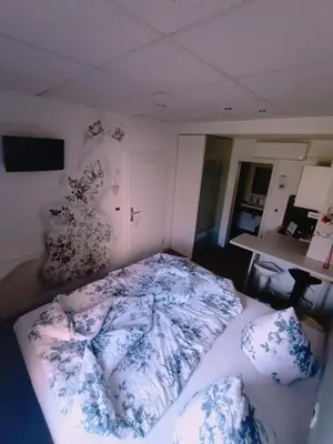Ein Bett oder Betten in einem Zimmer der Unterkunft BoardingHouse Sinsheim zentral am Burgplatz