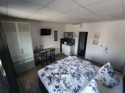 Ein Bett oder Betten in einem Zimmer der Unterkunft BoardingHouse Sinsheim zentral am Burgplatz