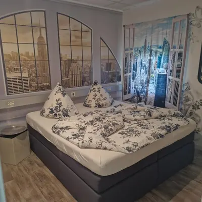 Ein Bett oder Betten in einem Zimmer der Unterkunft BoardingHouse Sinsheim zentral am Burgplatz