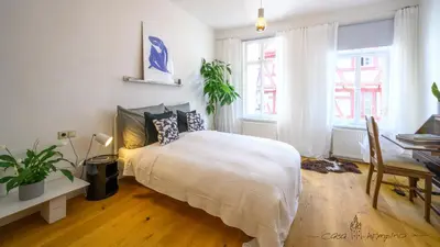 Ein Bett oder Betten in einem Zimmer der Unterkunft Casa Wimpina - geschmackvolles Appartement im Herzen der Altstadt