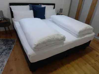 Ein Bett oder Betten in einem Zimmer der Unterkunft Ferienwohnung Färberloft