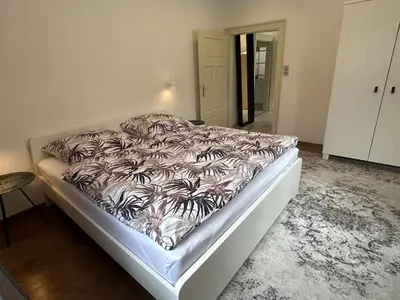 Ein Bett oder Betten in einem Zimmer der Unterkunft Nibelungen 4 Zimmer Apartment