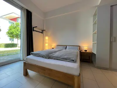 Ein Bett oder Betten in einem Zimmer der Unterkunft The East Apartment by Rabe - Parkplatz, Smart-TV, Netflix