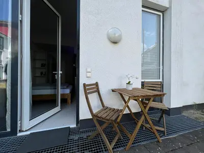 Ein Balkon oder eine Terrasse in der Unterkunft The East Apartment by Rabe - Parkplatz, Smart-TV, Netflix