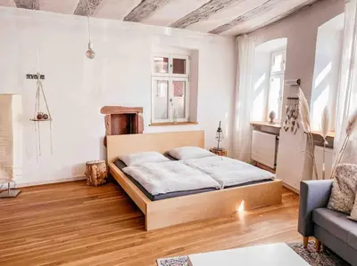 Ein Bett oder Betten in einem Zimmer der Unterkunft Ferienwohnung in maison de grès