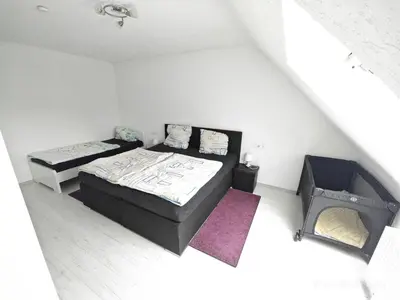 Ein Bett oder Betten in einem Zimmer der Unterkunft Urlaub am Rhein Speyer Hockenheim