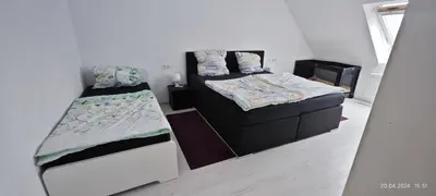 Ein Bett oder Betten in einem Zimmer der Unterkunft Urlaub am Rhein Speyer Hockenheim