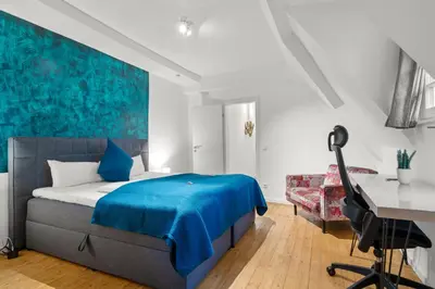 Ein Bett oder Betten in einem Zimmer der Unterkunft Traumhaft gelegene Altbau-Wohnung im Herzen von Weinheim - Parking