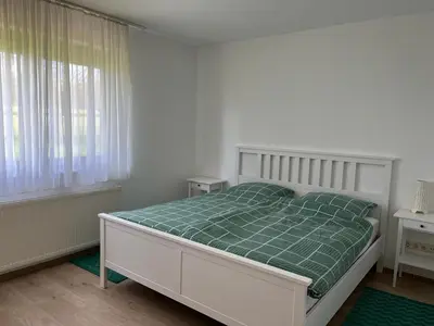 Ein Bett oder Betten in einem Zimmer der Unterkunft Weingut Sparrmühle Clarissa und Werner Manz GbR