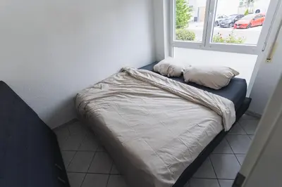 Ein Bett oder Betten in einem Zimmer der Unterkunft Appartment in den Weinbergen bei Mainz - mit 2x Doppelzimmern, 1x großes Wohnzimmer, Bad & Küche