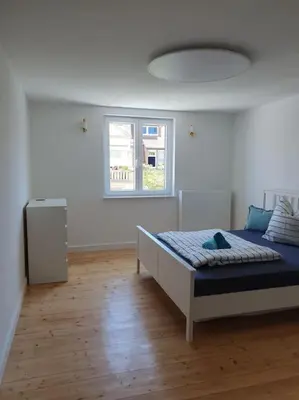 Ein Bett oder Betten in einem Zimmer der Unterkunft 3.OG / Top 4 Zimmer Wohnung KA-West