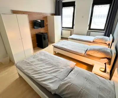 Ein Bett oder Betten in einem Zimmer der Unterkunft 4RENT Apartments - Monteurzimmer