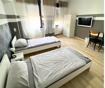 Ein Bett oder Betten in einem Zimmer der Unterkunft 4RENT Apartments - Monteurzimmer