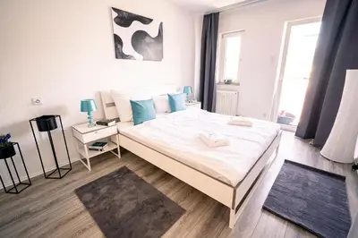 Ein Bett oder Betten in einem Zimmer der Unterkunft City Suite - 5 Min to HBF