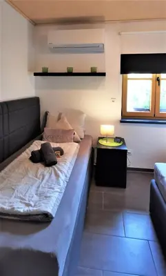 Ein Bett oder Betten in einem Zimmer der Unterkunft Ferienwohnung Strata Montana