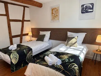 Ein Bett oder Betten in einem Zimmer der Unterkunft Workers Lodge für 4-14 Pers, Parkplatz, Wlan, Einzelbetten