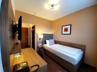 Ein Bett oder Betten in einem Zimmer der Unterkunft Hotel in den Herrnwiesen