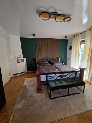Ein Bett oder Betten in einem Zimmer der Unterkunft Ferienwohnung Waldliebe Hinterweidenthal