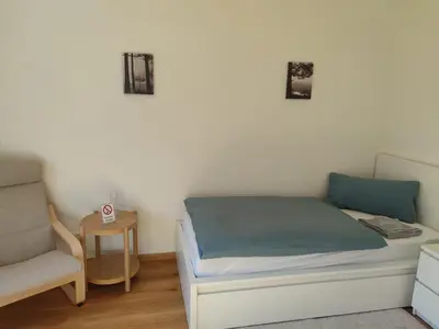 Ein Bett oder Betten in einem Zimmer der Unterkunft Gästehaus Windheim Grötzingen