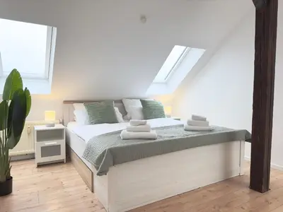 Ein Bett oder Betten in einem Zimmer der Unterkunft MyStay I Central Lofts I Superior Design Apartments Heidelberg