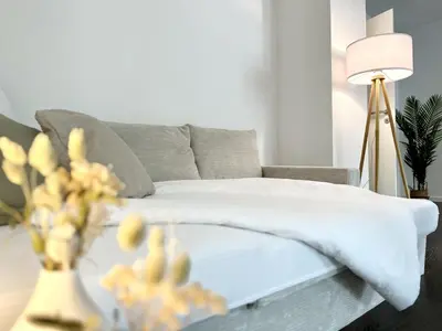 Ein Bett oder Betten in einem Zimmer der Unterkunft MyStay I Central Lofts I Superior Design Apartments Heidelberg