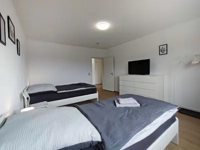 Ein Bett oder Betten in einem Zimmer der Unterkunft ERB01 - 2-Zimmer-Apartment mit Balkon in Bad König