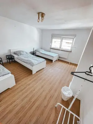 Ein Bett oder Betten in einem Zimmer der Unterkunft Unterkunft SL