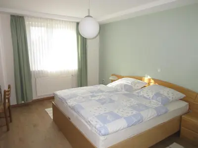 Ein Bett oder Betten in einem Zimmer der Unterkunft Ferienwohnung Obstgarten