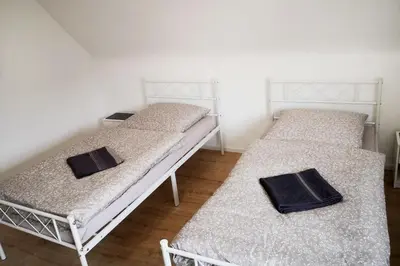 Ein Bett oder Betten in einem Zimmer der Unterkunft Boardinghouse in Mörfelden-Walldorf