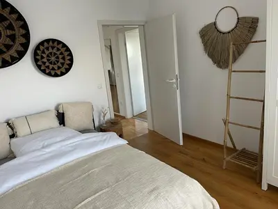 Ein Bett oder Betten in einem Zimmer der Unterkunft Ferienwohnung in Maikammer