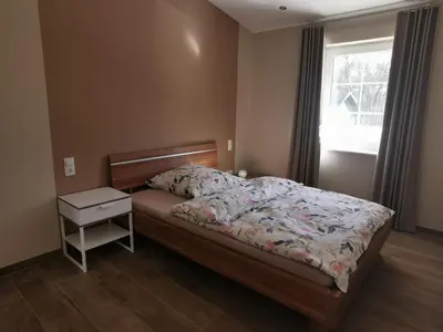 Ein Bett oder Betten in einem Zimmer der Unterkunft Ferienwohnung Gestüt von Erden