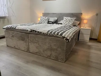 Ein Bett oder Betten in einem Zimmer der Unterkunft Schicke Ferienwohnung Philippsburg
