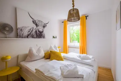 Ein Bett oder Betten in einem Zimmer der Unterkunft Pfälzer Weinperle mit Terrasse
