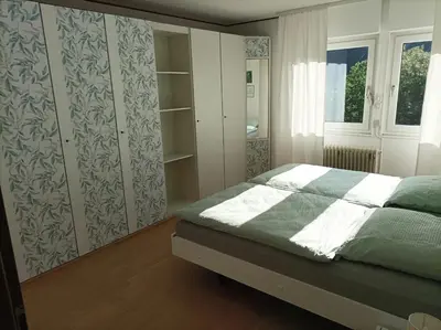 Ein Bett oder Betten in einem Zimmer der Unterkunft Große Ferienwohnung am Waldrand