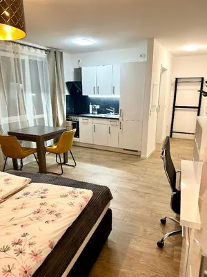 Ein Bett oder Betten in einem Zimmer der Unterkunft Moderne 1-Zi Stadtwohnung
