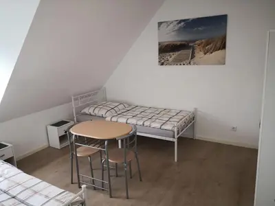 Ein Bett oder Betten in einem Zimmer der Unterkunft Beautiful Maisonette in Mörfelden-Walldorf